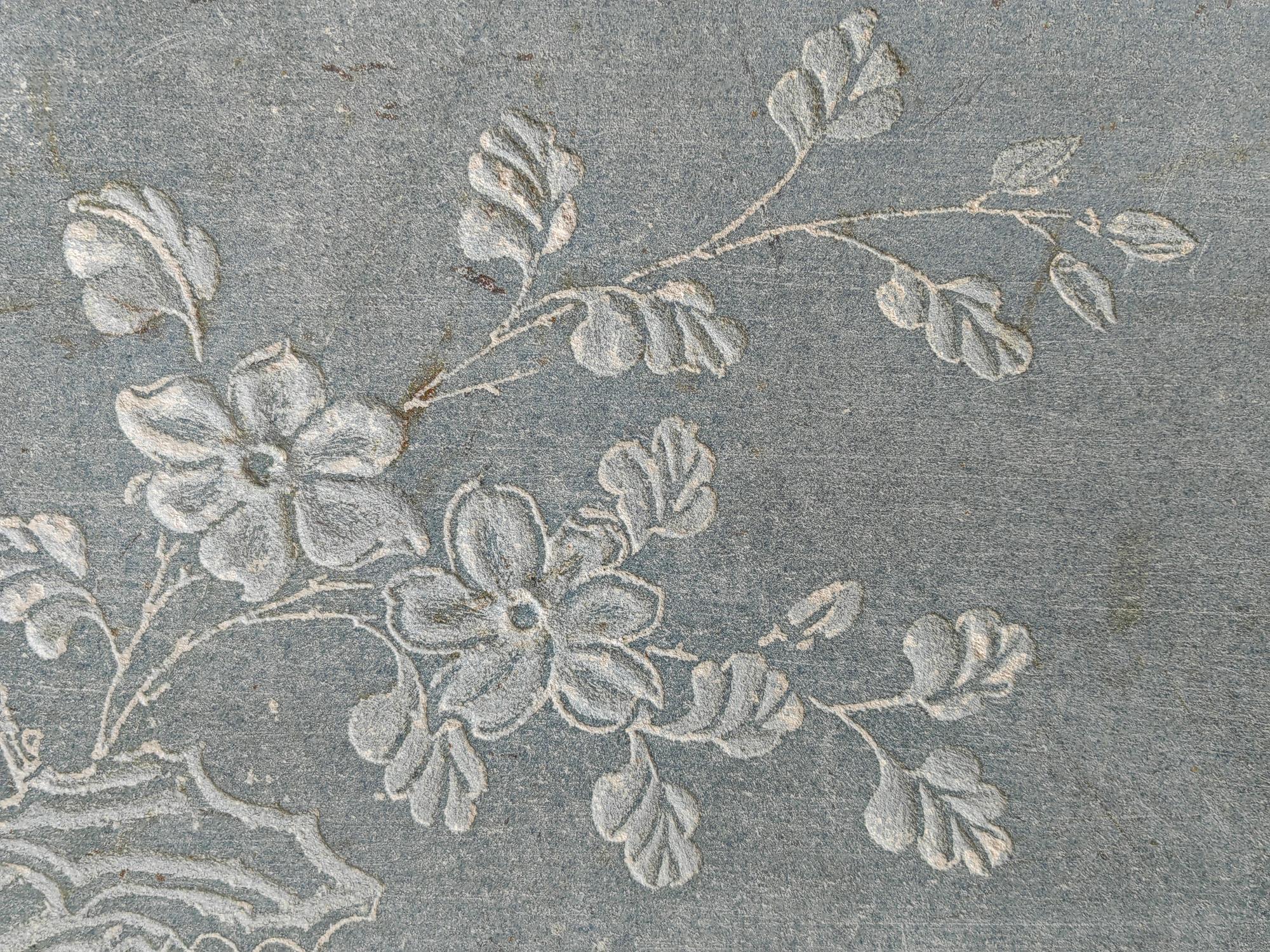 Close-up floral embroidery motif on linen